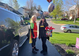 Dressing up and delivering birthday cakes and gifts to patients